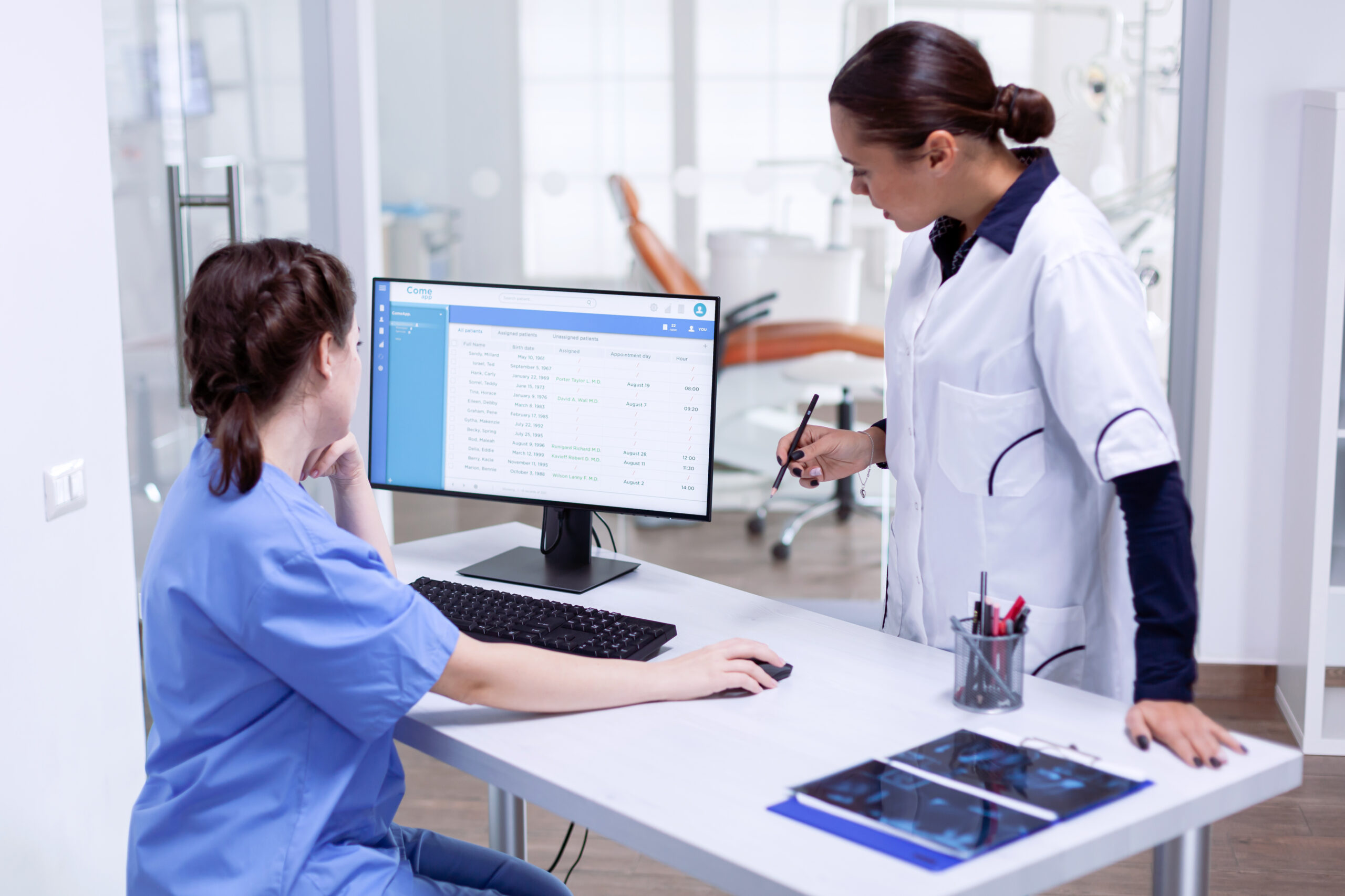 Medical-billing-virtual-assistants-helping-healthcare-provider-with-digital-billing-and-patient-records-on-a-computer-scaled